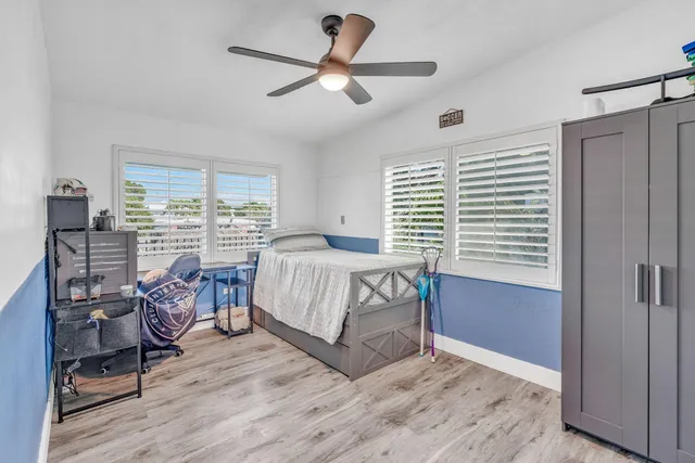 a bed room with a bed and a window