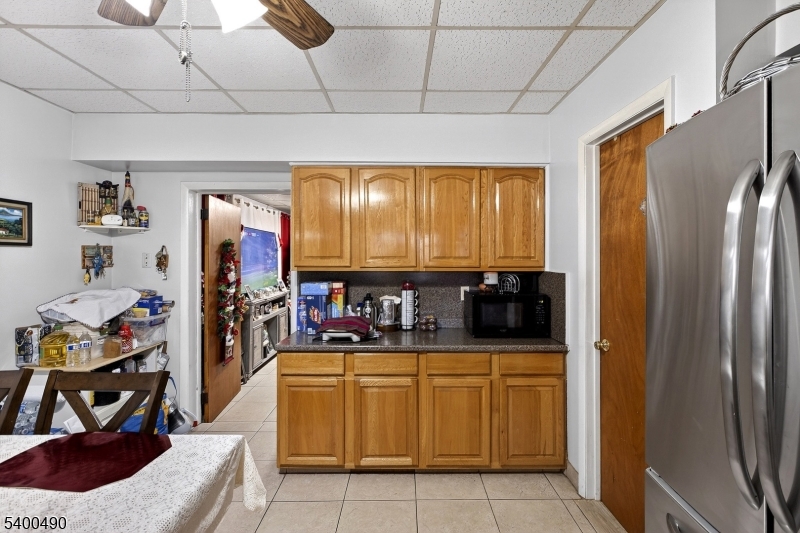 1029 East 19th Street Paterson, NJ 07501 - Photo 14 of 19 a room with lots of appliances and furniture