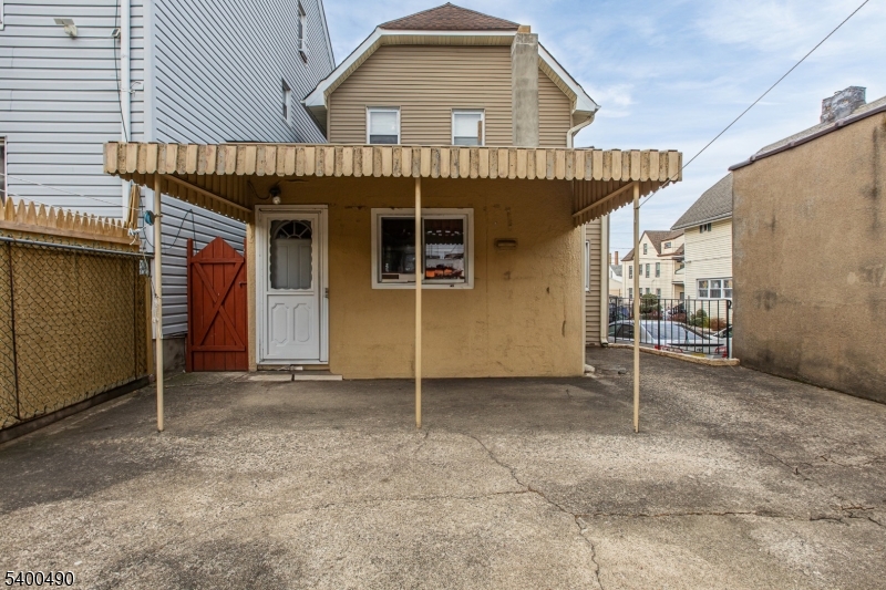 1029 East 19th Street Paterson, NJ 07501 - Photo 3 of 19 a view of a house with porch