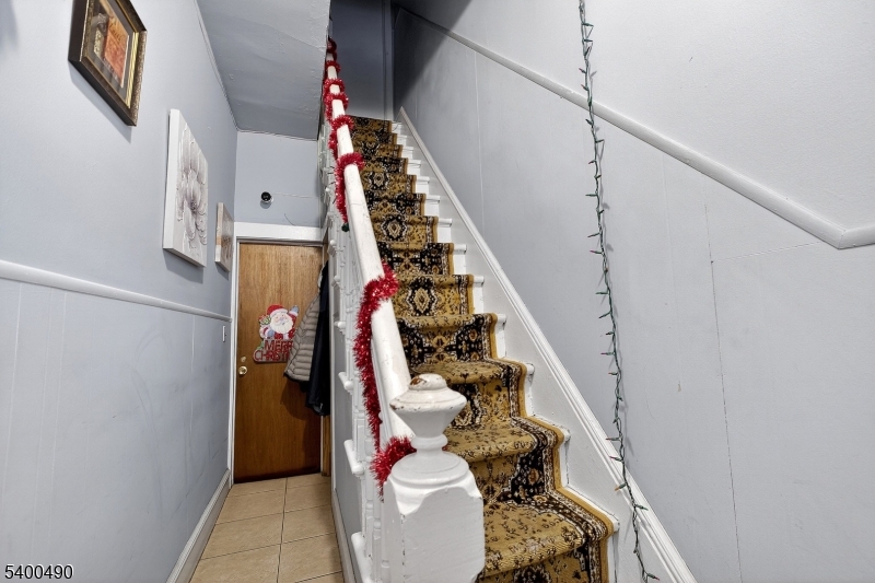 1029 East 19th Street Paterson, NJ 07501 - Photo 7 of 19 a view of an entryway with wooden floor