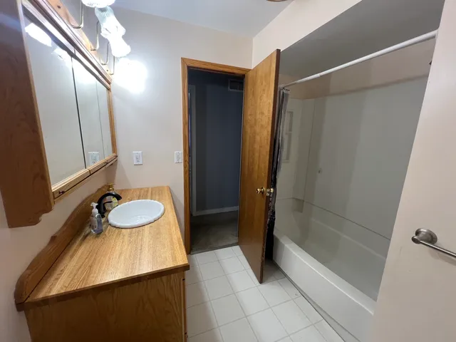 a view of an empty room and a windows