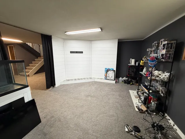 a room with toys and a wooden floor