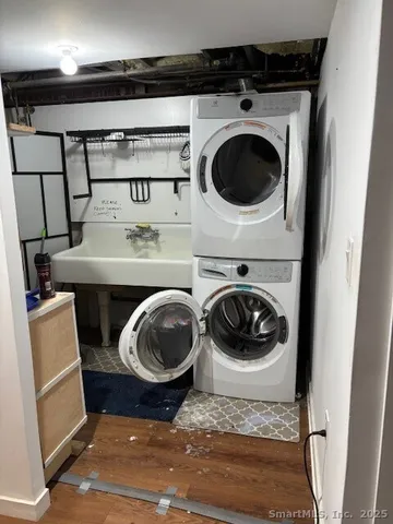 a utility room with sink washer and dryer