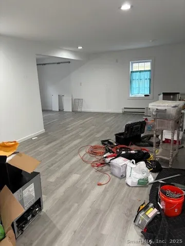 a bedroom with furniture and a window