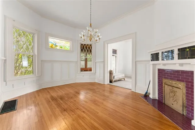 a bedroom with a bed and a fireplace