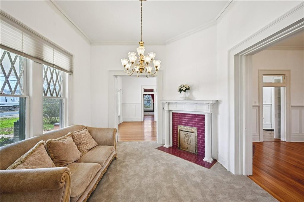 2140 North Broad Street Commerce, GA 30529 - Photo 14 of 33 a living room with furniture and a chandelier