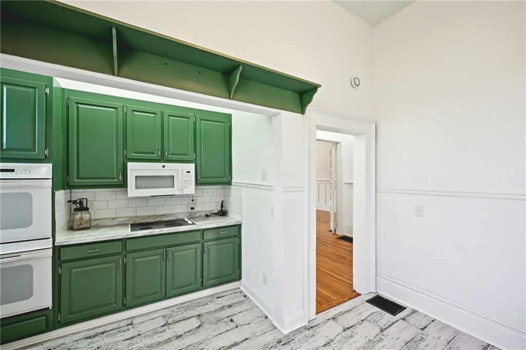 2140 North Broad Street Commerce, GA 30529 - Photo 16 of 33 a kitchen with a refrigerator and a sink