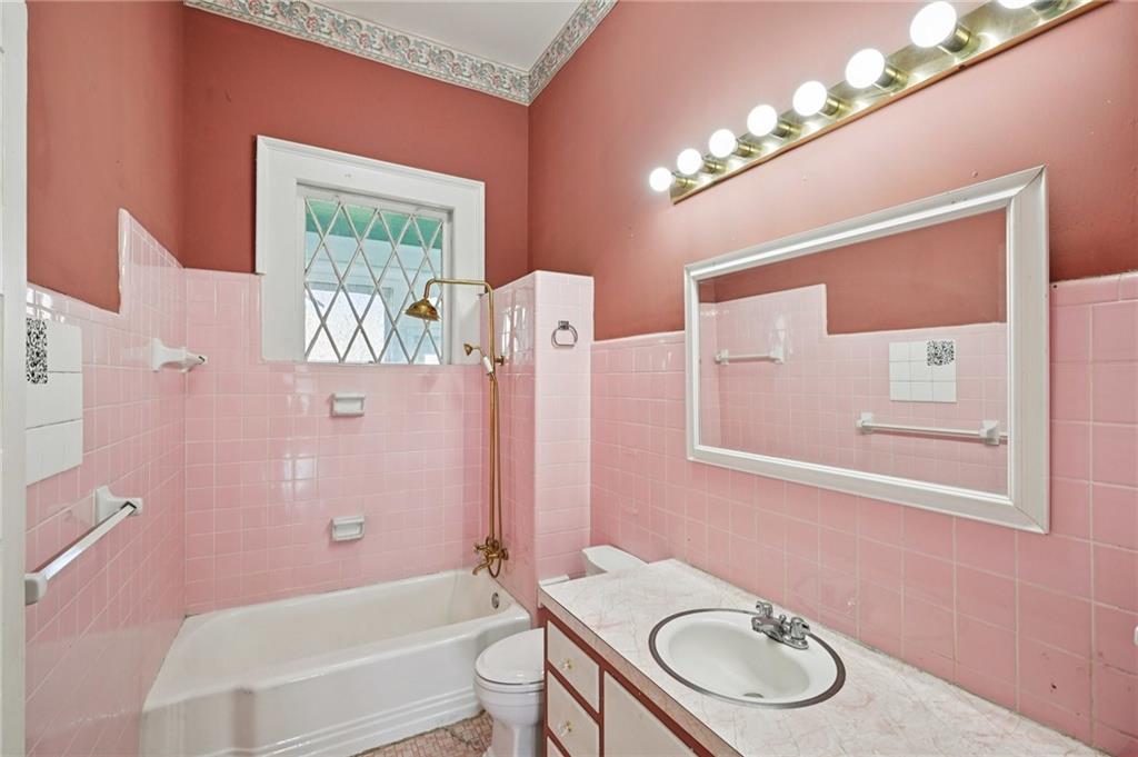 2140 North Broad Street Commerce, GA 30529 - Photo 18 of 33 a bathroom with a granite countertop sink toilet and shower