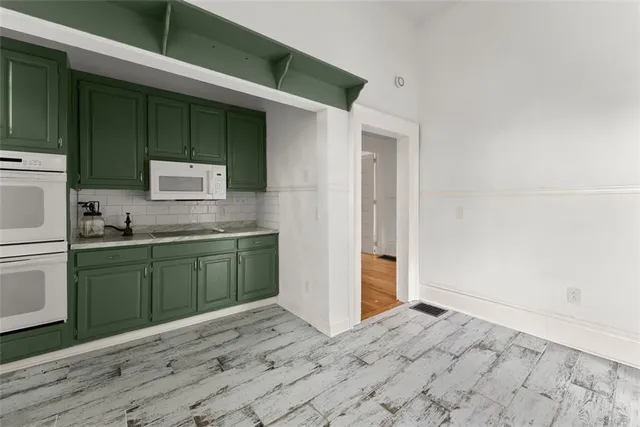 a kitchen with a sink and cabinets