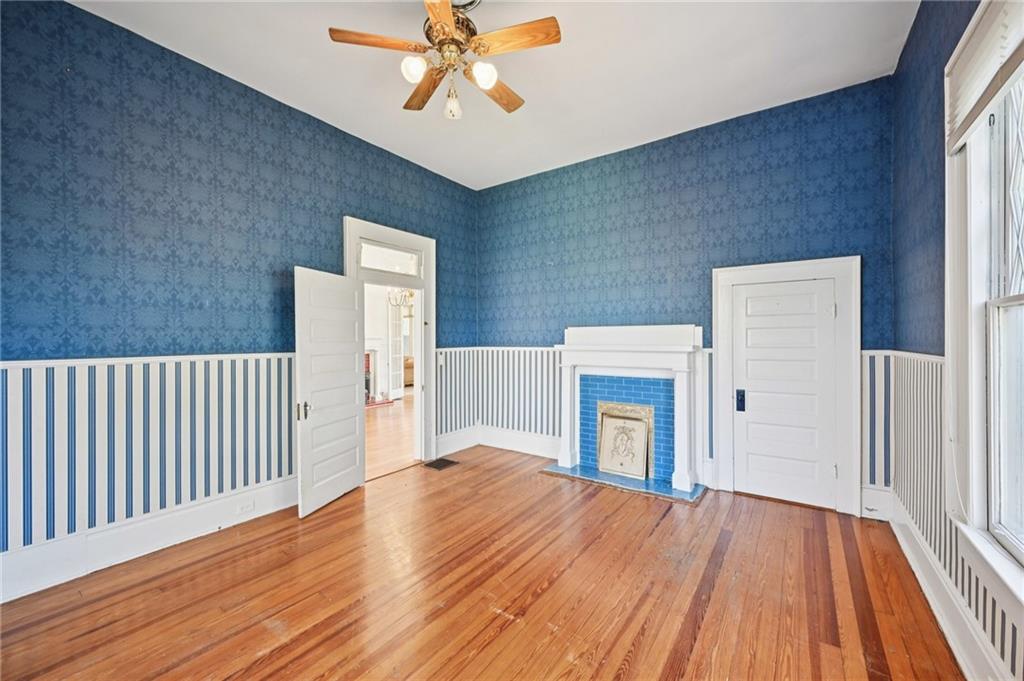 2140 North Broad Street Commerce, GA 30529 - Photo 25 of 33 a view of an empty room with wooden floor and a window