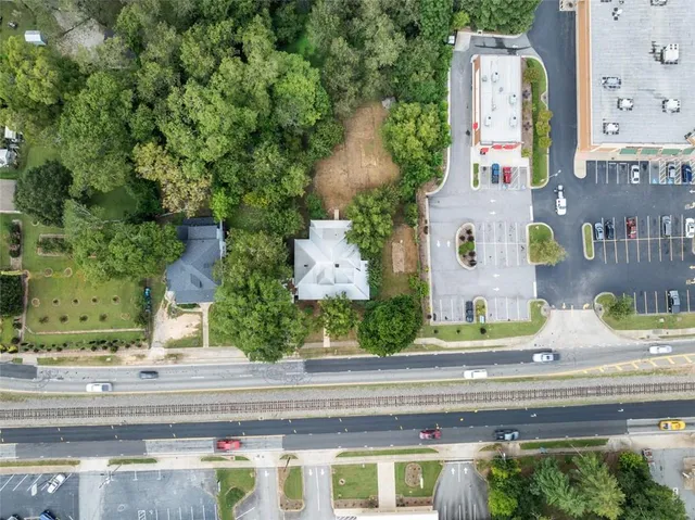 an aerial view of a house with a swimming pool