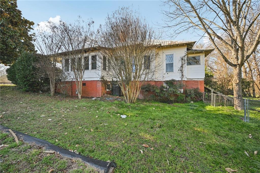 2140 North Broad Street Commerce, GA 30529 - Photo 27 of 33 a view of a house with backyard and a tree