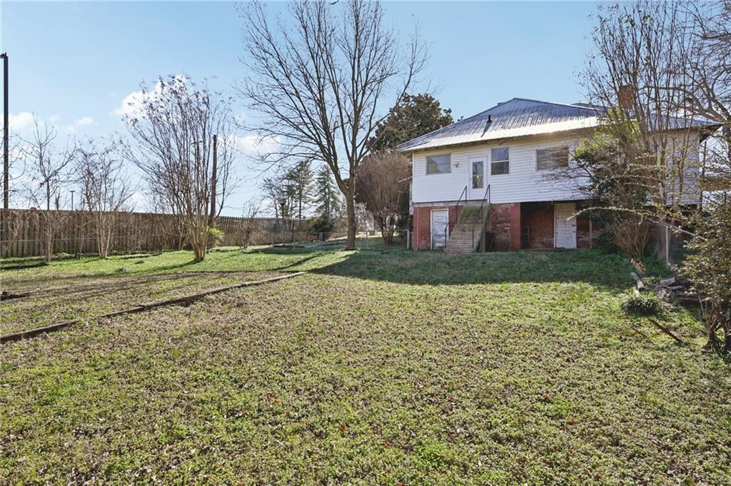 2140 North Broad Street Commerce, GA 30529 - Photo 28 of 33 a view of a house with a yard