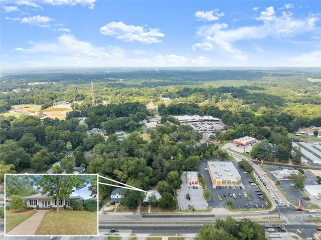 an aerial view of residential building with trees