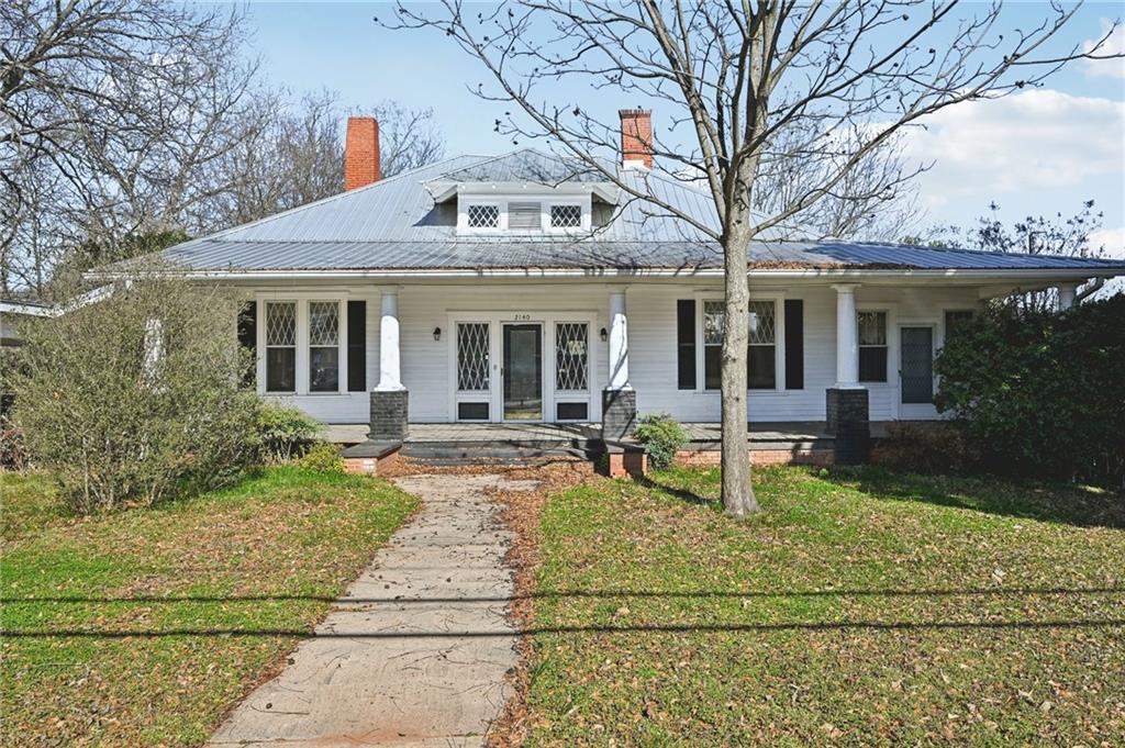 2140 North Broad Street Commerce, GA 30529 - Photo 3 of 33 a view of a house with sitting area and garden