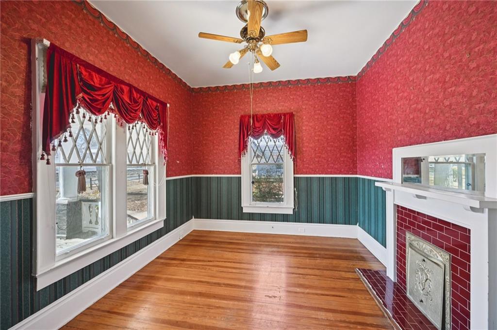 2140 North Broad Street Commerce, GA 30529 - Photo 10 of 33 a bedroom with a bed and a chandelier