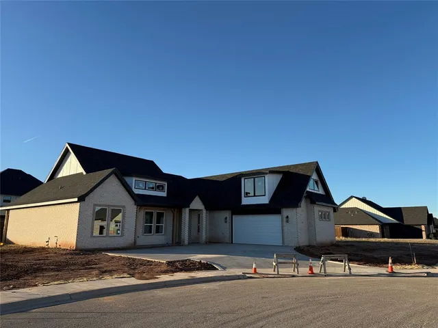 a front view of a house with yard