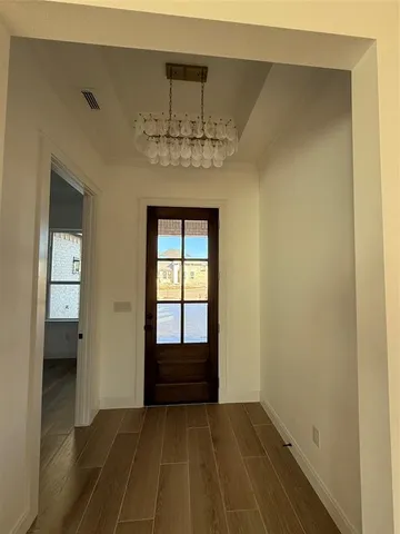 a view of an empty room with a bathroom