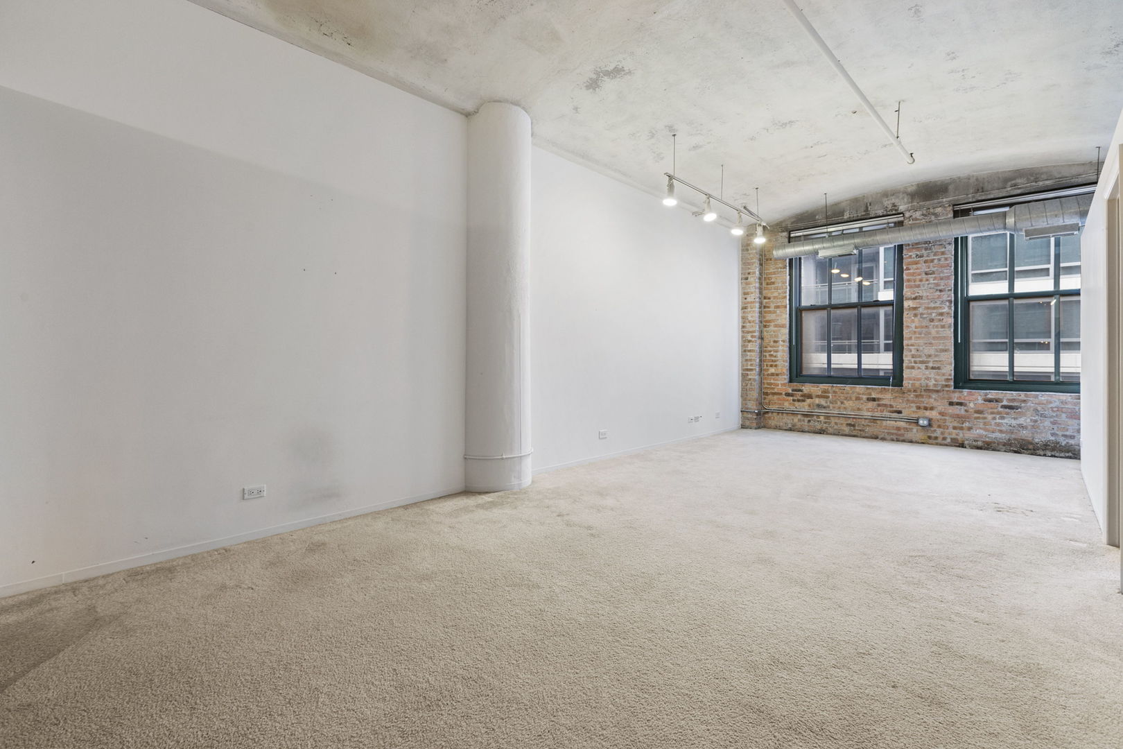 801 South Wells Street, Unit 808 Chicago, IL 60607 - Photo 5 of 15 an empty room with large windows