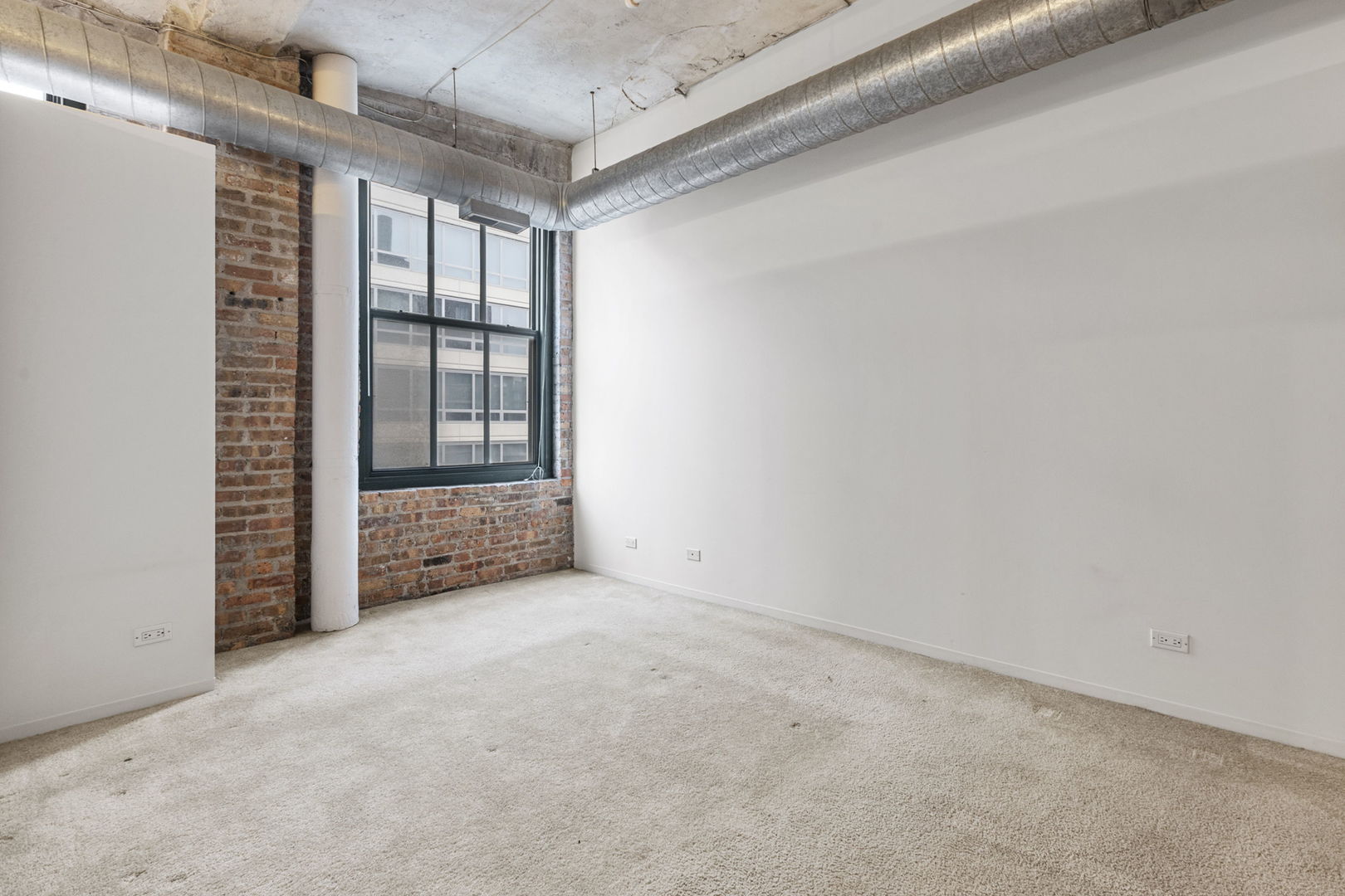 801 South Wells Street, Unit 808 Chicago, IL 60607 - Photo 6 of 15 a view of an empty room with a window