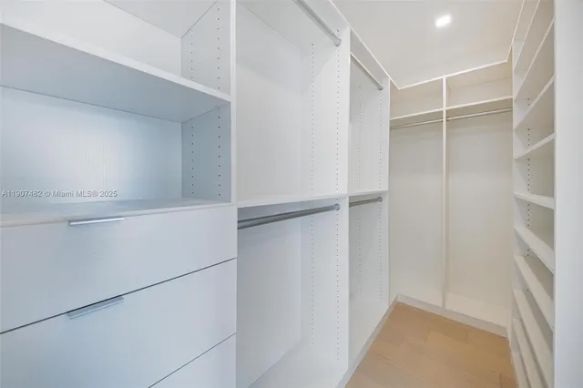 a view of an empty walk in closet