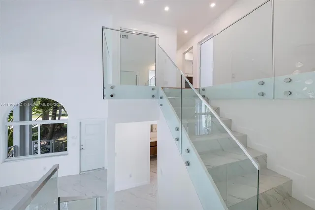 a kitchen with a sink and large window