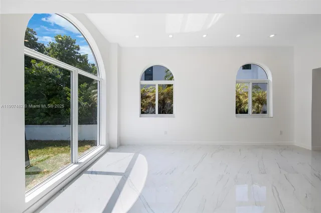 a view of a kitchen from the hallway