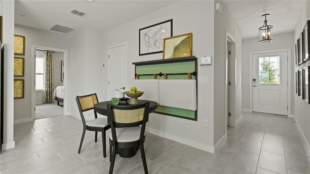 1353 June Lake Loop Haines City, FL 33844 - Photo 13 of 44 a view of a dining room with furniture