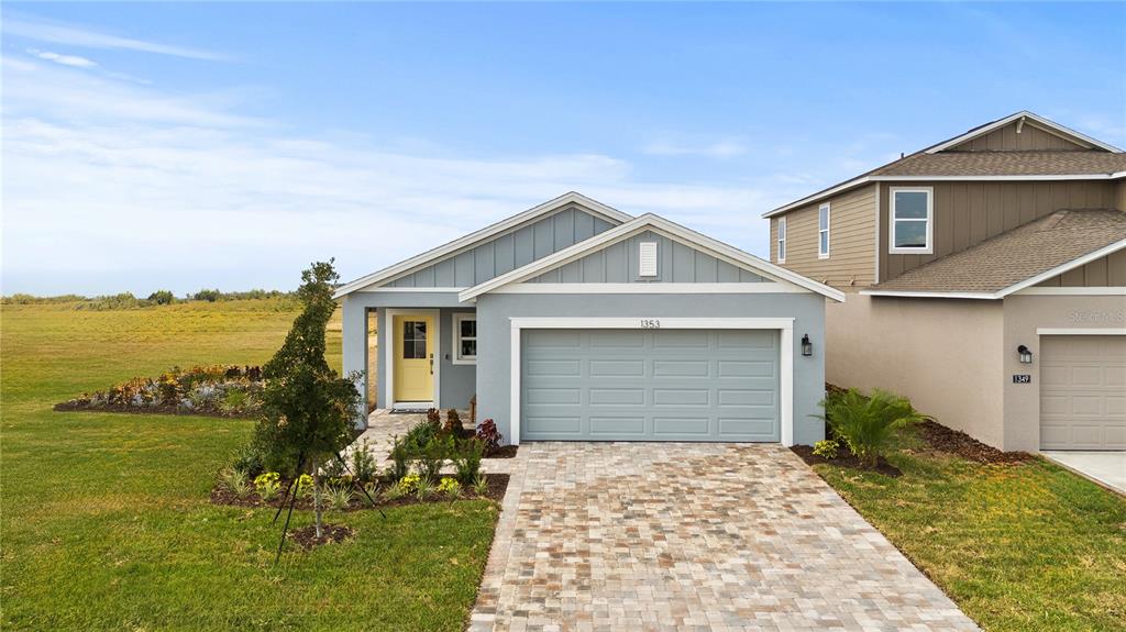 1353 June Lake Loop Haines City, FL 33844 - Photo 2 of 44 a front view of house with yard