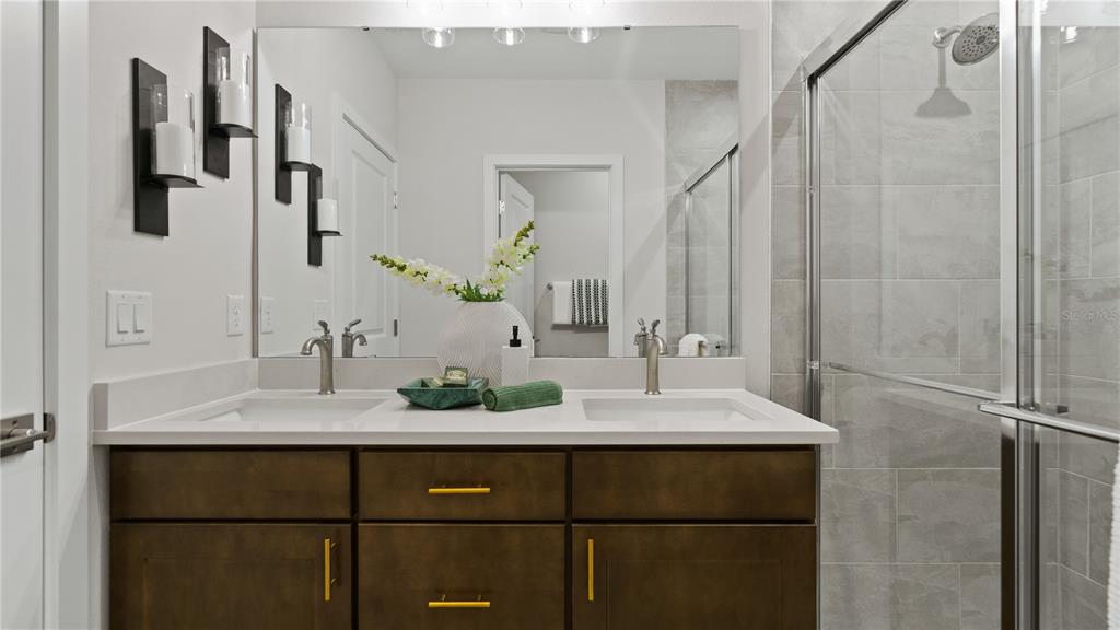 1353 June Lake Loop Haines City, FL 33844 - Photo 40 of 44 a bathroom with a sink and a mirror