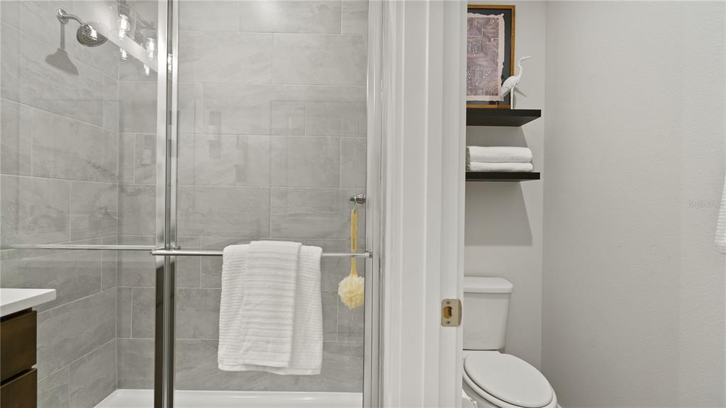 1353 June Lake Loop Haines City, FL 33844 - Photo 41 of 44 a bathroom with a toilet and a shower