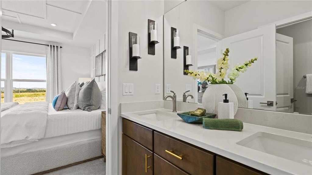 1353 June Lake Loop Haines City, FL 33844 - Photo 42 of 44 a bathroom with sink and mirror