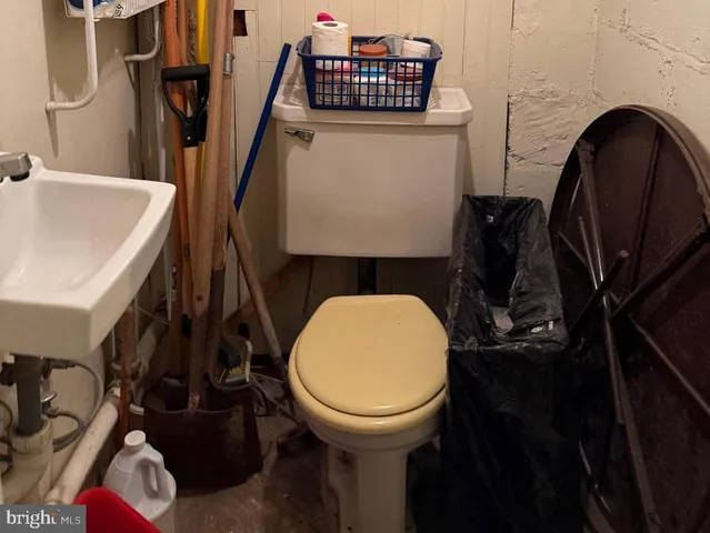 a bathroom with a sink a toilet and a tub