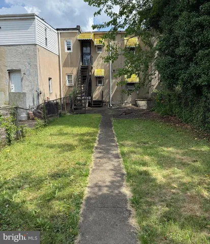 a view of a back yard of the house