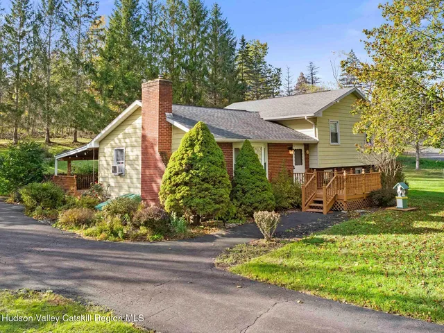 front view of a house with a small yard