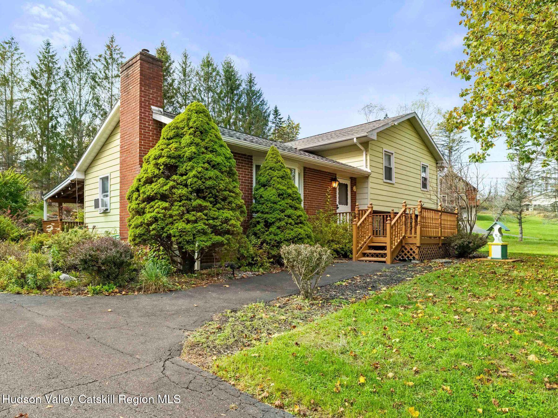 1339 Cornwallville Road Cornwallville, NY 12418 - Photo 13 of 47 a view of a house with a small yard and sitting area