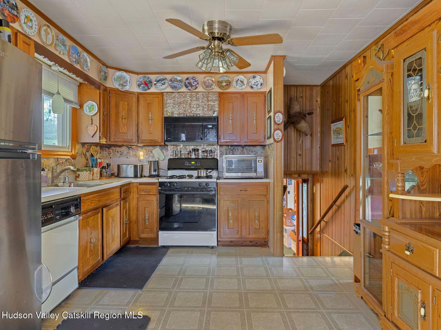1339 Cornwallville Road Cornwallville, NY 12418 - Photo 20 of 47 a kitchen with stainless steel appliances granite countertop a stove and a refrigerator