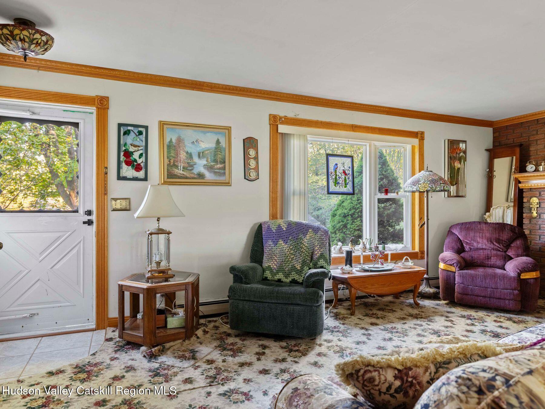 1339 Cornwallville Road Cornwallville, NY 12418 - Photo 28 of 47 a living room with furniture and a window