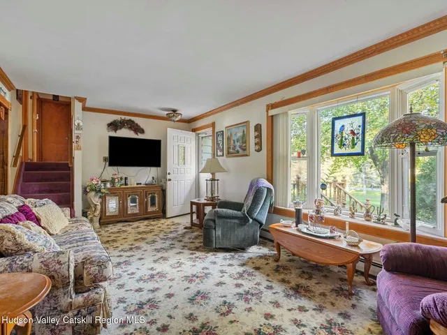 a view of hallway with a mirror and a window