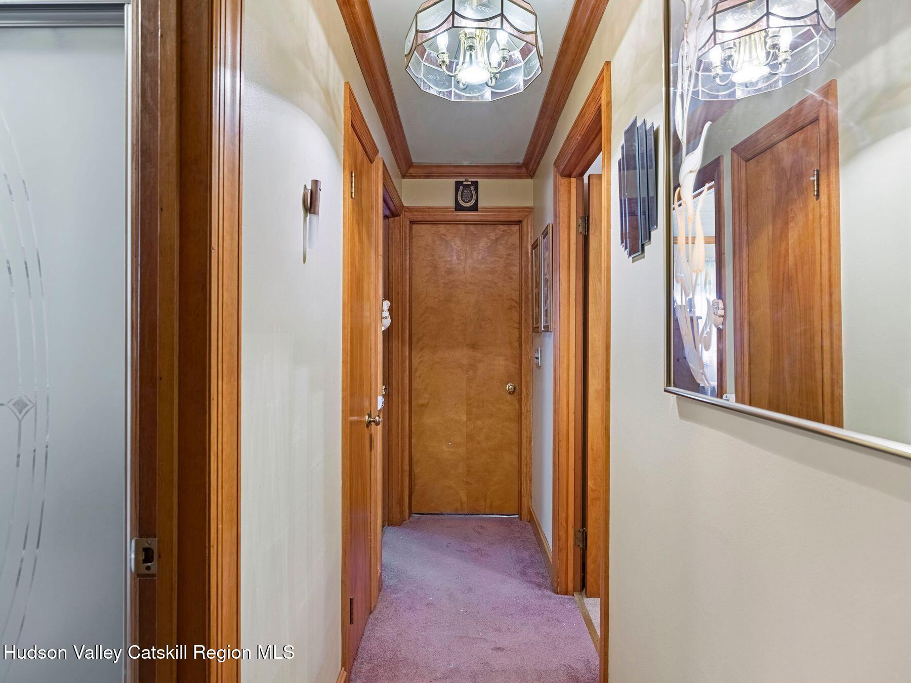 1339 Cornwallville Road Cornwallville, NY 12418 - Photo 30 of 47 a view of hallway with a mirror and a window