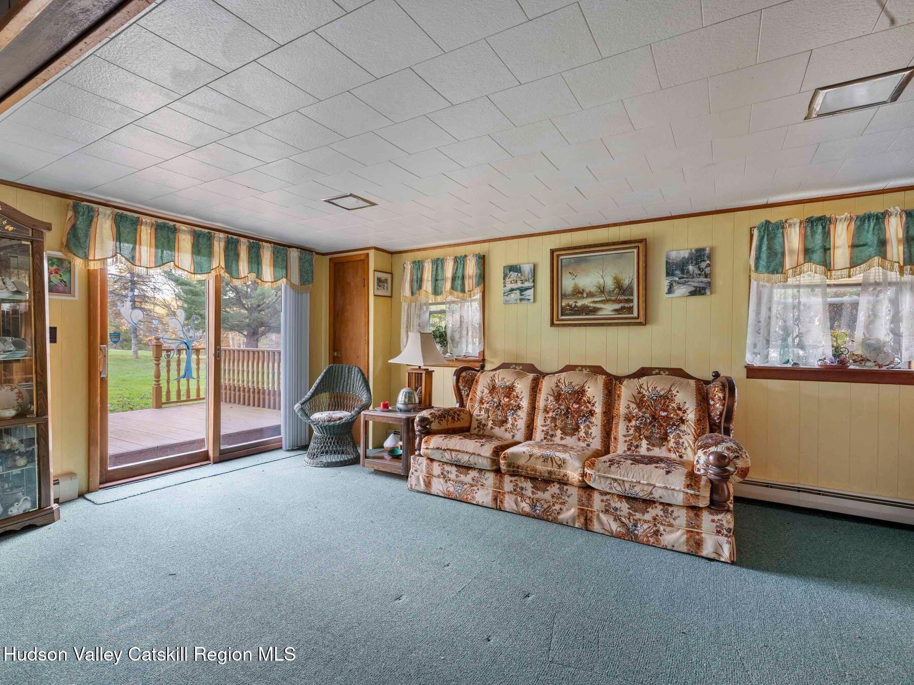 1339 Cornwallville Road Cornwallville, NY 12418 - Photo 40 of 47 a living room with furniture and large windows