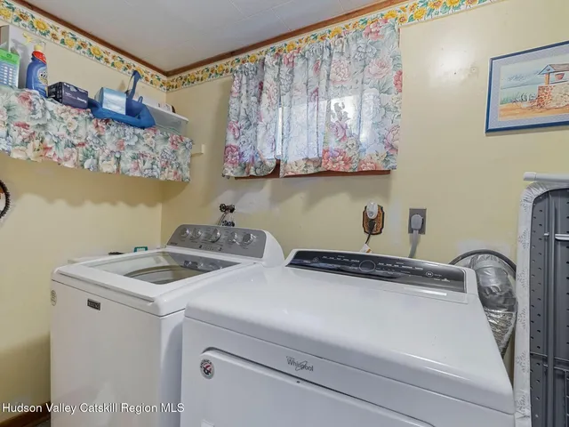 a view of a room with wooden walls