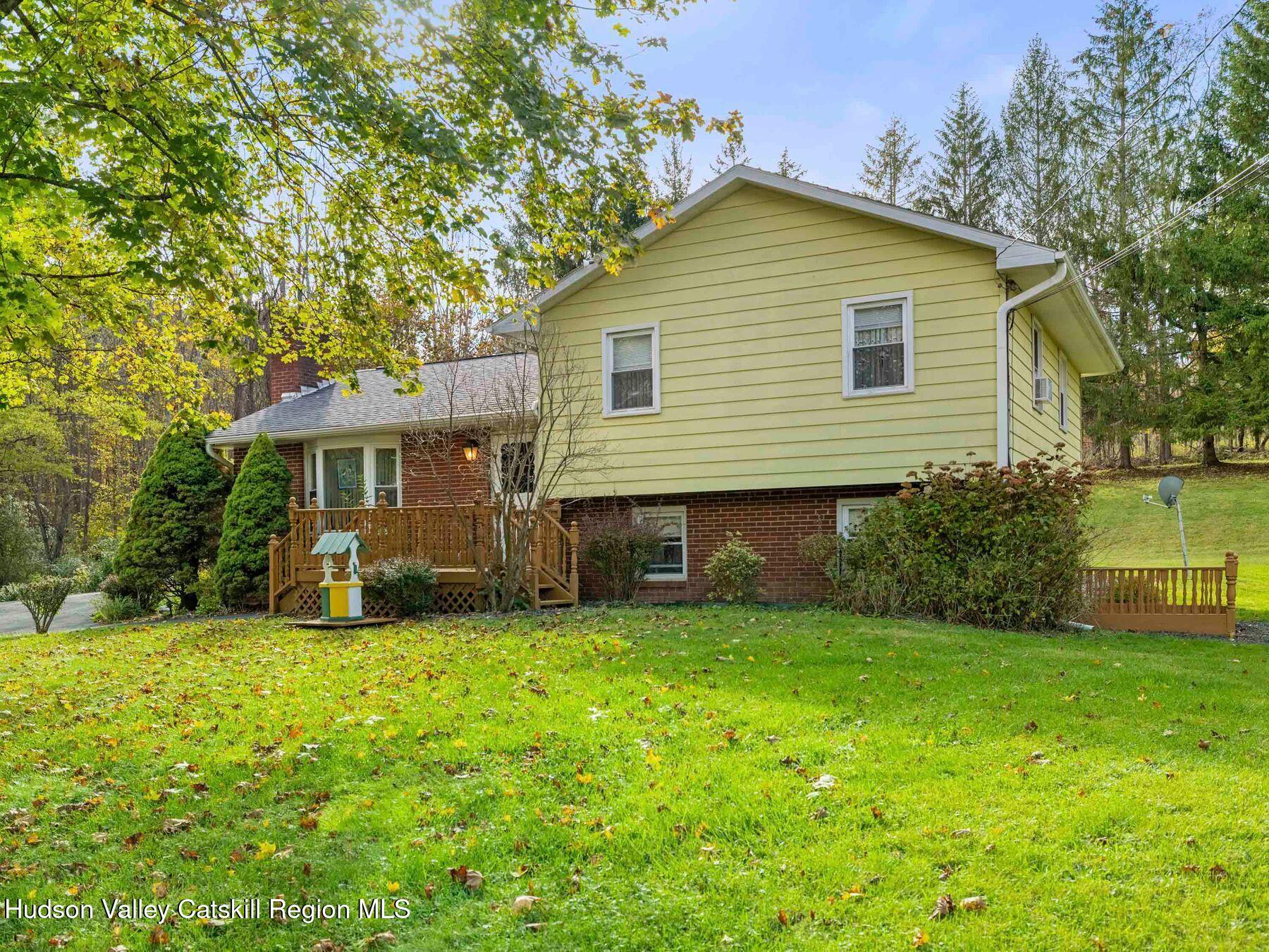 1339 Cornwallville Road Cornwallville, NY 12418 - Photo 45 of 47 a view of a house with a yard and sitting area