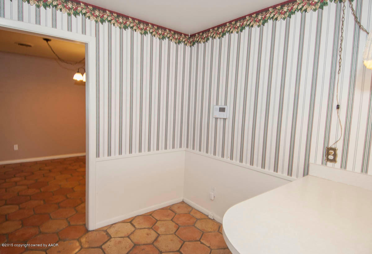6016 Gainsborough Road Amarillo, TX 79106 - Photo 12 of 36 a view of a room with a wooden door