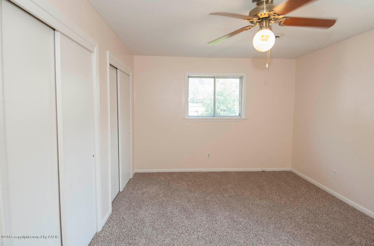 6016 Gainsborough Road Amarillo, TX 79106 - Photo 15 of 36 an empty room with windows and fan