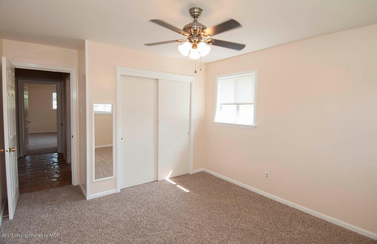 6016 Gainsborough Road Amarillo, TX 79106 - Photo 25 of 36 wooden floor in an empty room and a window