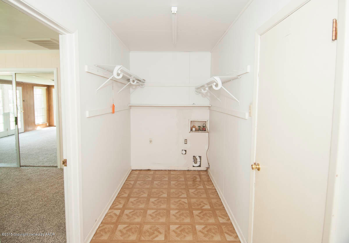 6016 Gainsborough Road Amarillo, TX 79106 - Photo 30 of 36 a view of a hallway with wooden floor and staircase