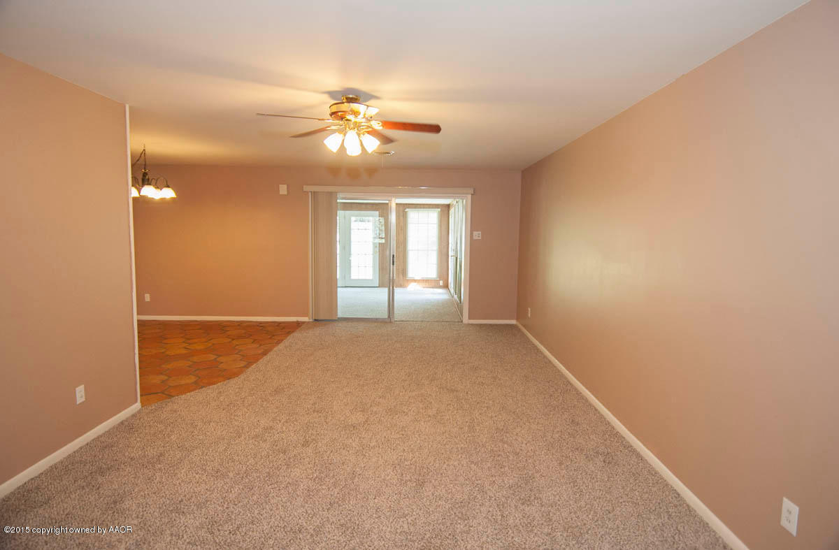 6016 Gainsborough Road Amarillo, TX 79106 - Photo 5 of 36 a view of an empty room with a window