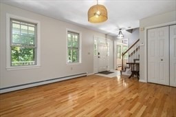 6 Mellen Street Hopedale, MA 01747 - Photo 12 of 42 a view of an empty room with wooden floor and a window