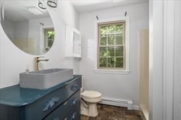 6 Mellen Street Hopedale, MA 01747 - Photo 27 of 42 a bathroom with a sink a toilet and a mirror